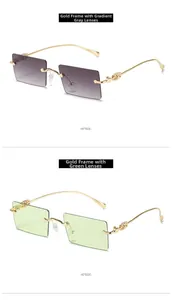 Close-up of vintage square rimless sunglasses with gold engraved temples and gradient lenses