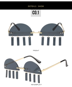 Detail view of semi-rimless sunglasses with gold frames and rectangle tassel pendants