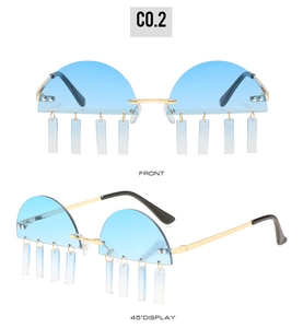 Close-up of semi-rimless sunglasses with blue lenses and dangling rectangle charms