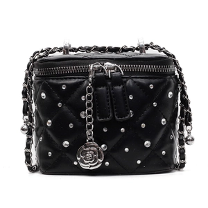 Black quilted mini crossbody bag with crystal accents and camellia chain strap