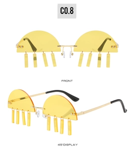 Detail of half-frame yellow sunglasses with hanging rectangular charms and gold frame