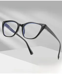 Detail of black cat-eye anti-blue light glasses with metal dot and blue lens reflection