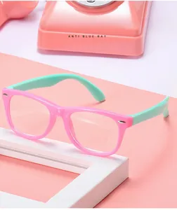 Pink and green kids anti-blue light glasses on a cute pink decorative background