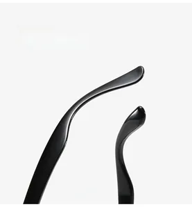 Macro view of curved ergonomic glasses temples made of glossy black flexible silicone