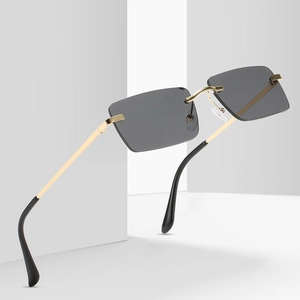 Lunettes de soleil rétro rectangulaires sans monture avec branches dorées et verres gris