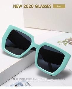 Detail of mint green square frame sunglasses with thick geometric temples on a white pedestal