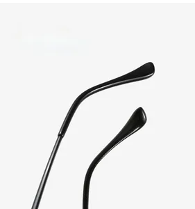 Macro shot of ergonomic black arc leg covers for TR90 eyewear frames showing texture