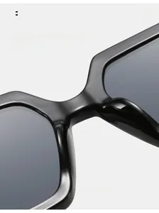 Detail view of comfortable integrated nose pads on black square frame sunglasses