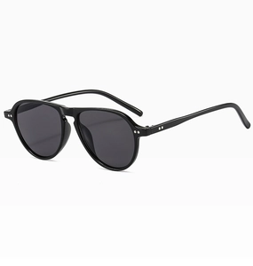 Detail of black aviator sunglasses with silver rivets on a double bridge frame