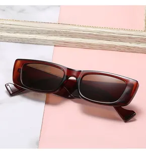 Detail view of tortoiseshell narrow rectangle sunglasses with unique hollow temple design