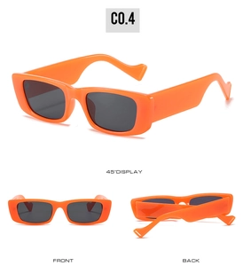 Three-angle display of bright orange rectangular sunglasses with wavy temples and heart detail