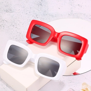 Chic oversized square sunglasses in bold red and white frames for retro fashion wear
