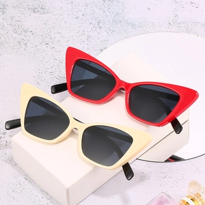 Retro small square cat eye sunglasses in vibrant red and beige with dark tinted lenses