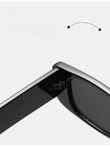 Detailed view of the durable metal hinge on these trendy black cat-eye sunglasses