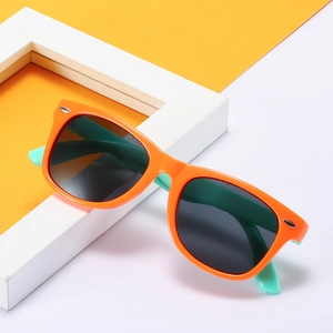 Vibrant orange and mint green polarized silicone sunglasses for kids with grey lenses