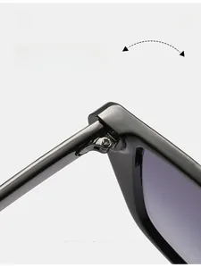 Detail shot of durable metal hinges on trendy black cat eye sunglasses for women