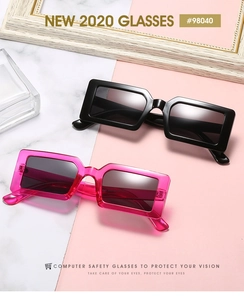 Close-up of black and jelly pink rectangular sunglasses with sturdy frames on marble texture