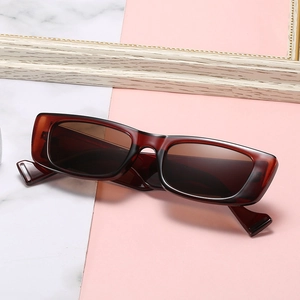 Retro narrow rectangular sunglasses with dark brown translucent frames and wide temples