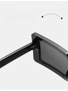 Detail shot of durable metal hinge on black square sunglasses for smooth folding