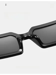 Close-up of seamless integrated nose pads on black rectangular sunglasses for comfort