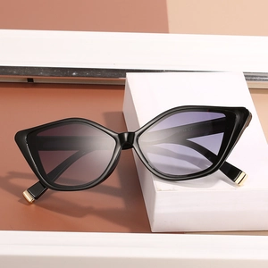 Cat eye sunglasses with black geometric frame and purple gradient lenses in 45-degree view