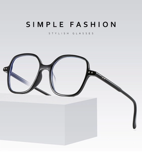Detail view of black square frame blue light glasses with metallic decorative rivets