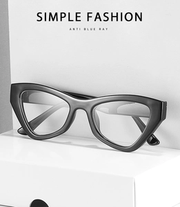 Simple fashion black cat eye glasses frame with anti blue ray lens on a white block