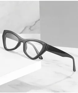 Detail of black cat-eye glasses frame with anti-blue light lenses on a white display stand