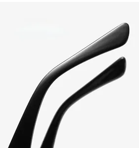 Close-up of ergonomic black metal temples on retro blue light blocking glasses