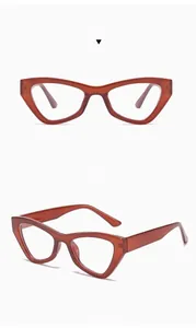 Detail view showing the positive and side angles of tea-colored cat eye glasses frames