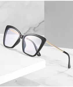 Close-up of cat-eye frames with anti-blue light coating and gold metal temples