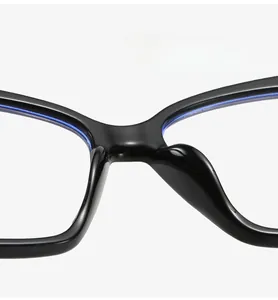 Detail of integrated comfortable nose pads on black cat-eye glasses to reduce pressure