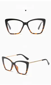 Detail view of cat eye glasses frames in black leopard print with gold metal temples