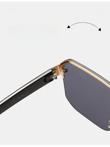 Detail of durable gold metal hinges and black temples on oversized square sunglasses