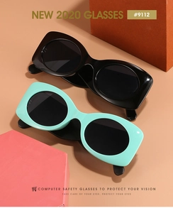 Detail of retro oval wide-arm sunglasses in black and mint green with blue light protection