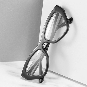 Retro black oversized cat-eye glasses frame with blue light blocking lenses on marble