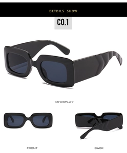 Détail des lunettes de soleil carrées noires avec branches larges ondulées et verres foncés
