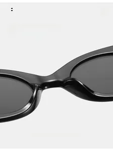 Macro shot of comfortable integrated nose pads on black oval frame retro sunglasses
