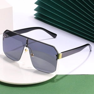 Oversized one-piece square sunglasses with gradient grey lenses and decorative rivets