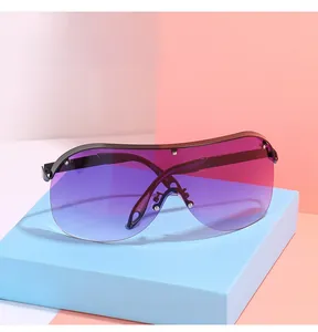 Detail of oversized shield sunglasses with purple gradient lenses and silver rivet studs