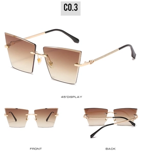 Lunettes de soleil œil de chat sans monture avec verres dégradés et branches dorées