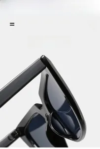 Detail view of lightweight black cat eye sunglasses featuring durable elastic temples