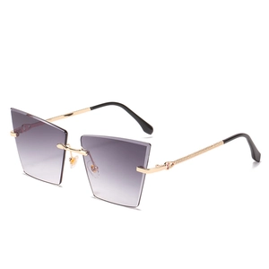 Lunettes de soleil œil de chat sans monture, verres dégradés violets et branches dorées
