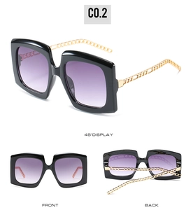 Three-view display of black square sunglasses with purple gradient lenses and gold chain arms