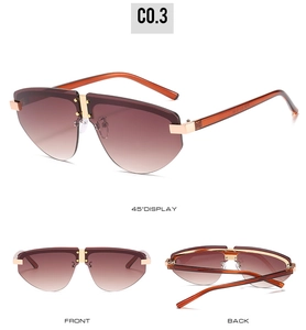 Detailed views of rimless aviator sunglasses with brown gradient lenses and amber temples