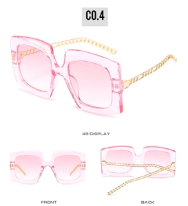 Three angles of pink square sunglasses with decorative gold chain metal temples