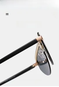 Detail view of grey gradient lenses and rose gold metal hinges on rimless sunglasses
