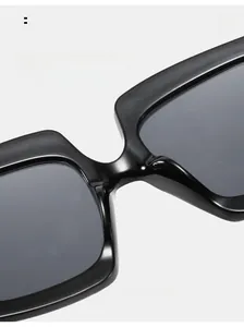 Detail of comfortable integrated nose pads on black oversized square sunglasses