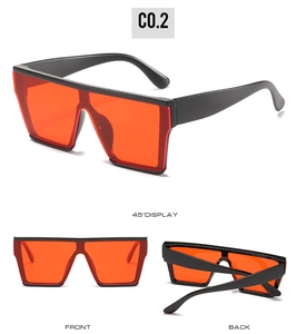 Three perspectives of oversized square sunglasses with thick black frames and red lenses