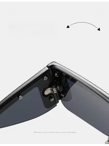 Detail of durable metal hinges with screw fixation on black fashion sunglasses